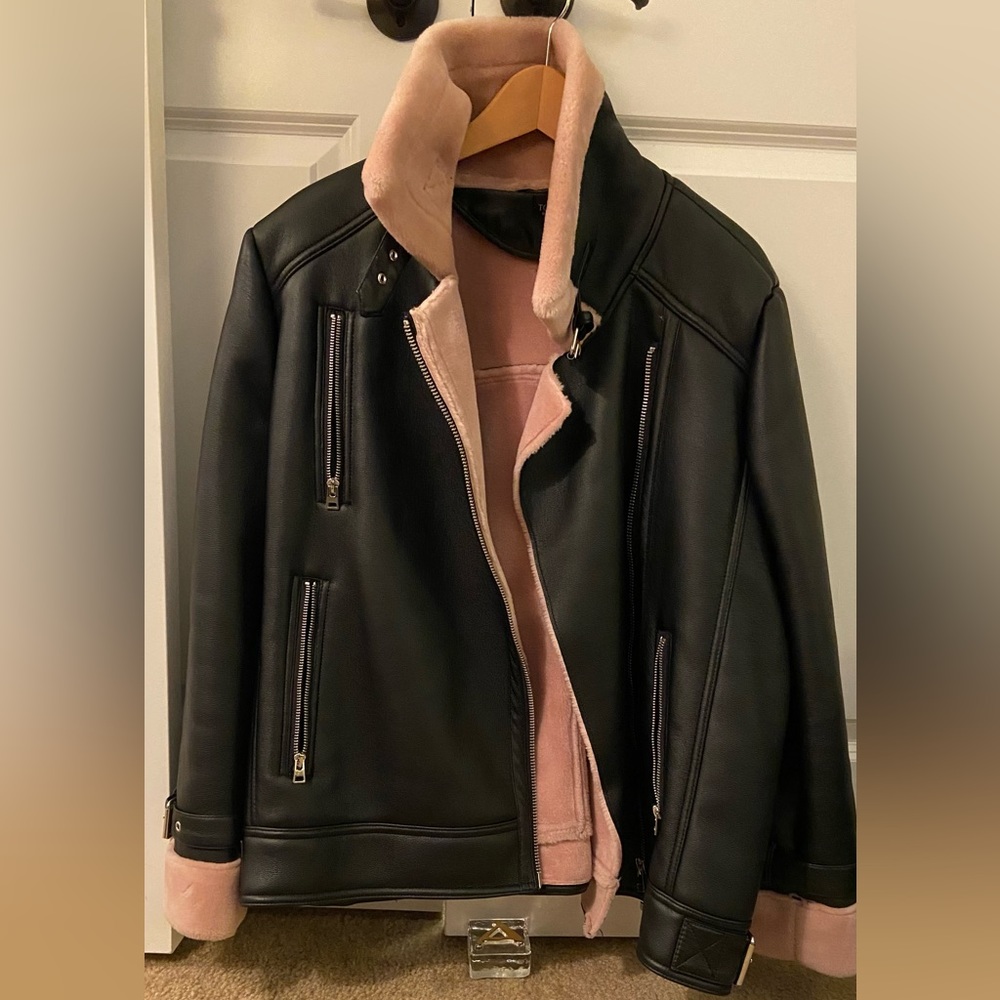 Oversized bomber jacket lined with faux pink fur.